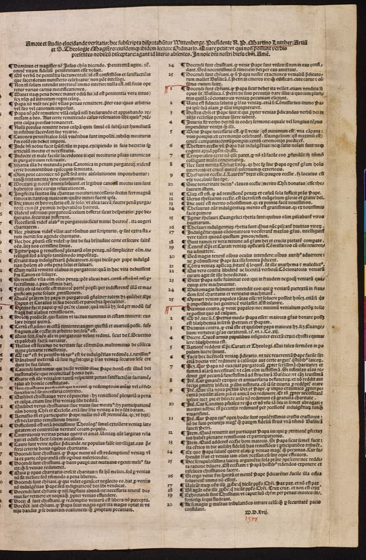A single printed sheet of Latin text in black-letter type, set in two columns of short numbered paragraphs under a two-line heading that begins Amore et studio elucidande veritatis. At the foot is the printed date M.D.Xvij., with 1517 written below it in red ink.